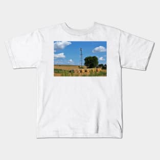 Kansas Windmill with Hay Bales and sky. Kids T-Shirt